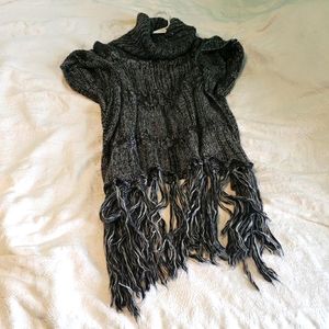 Thin knitted Pancho style throw over